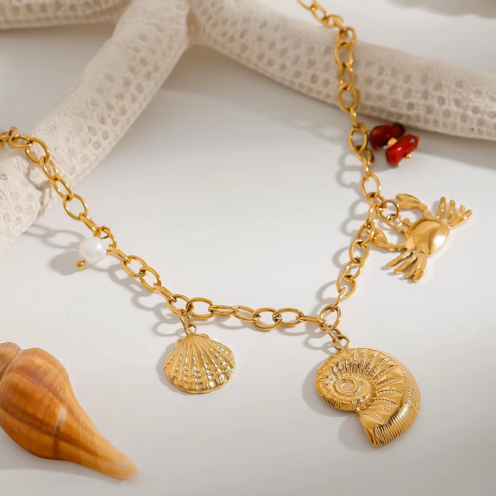 Raíz de Sal bañada en Oro 18k – Collar Dorado con Dijes Marinos